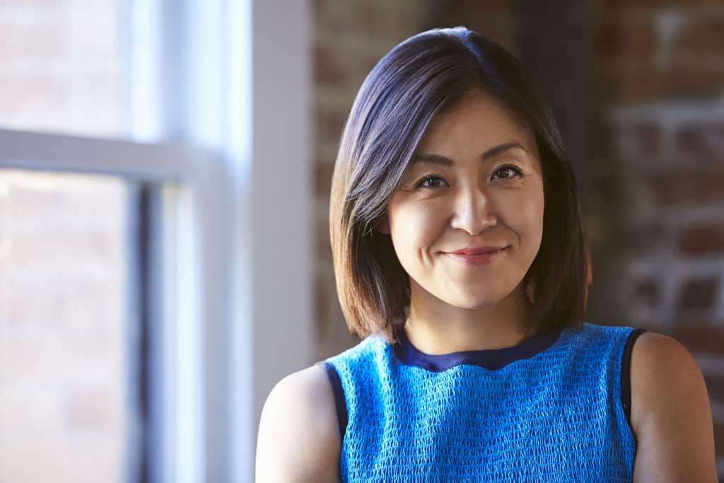 Business Woman in a Blue Dress Smiling